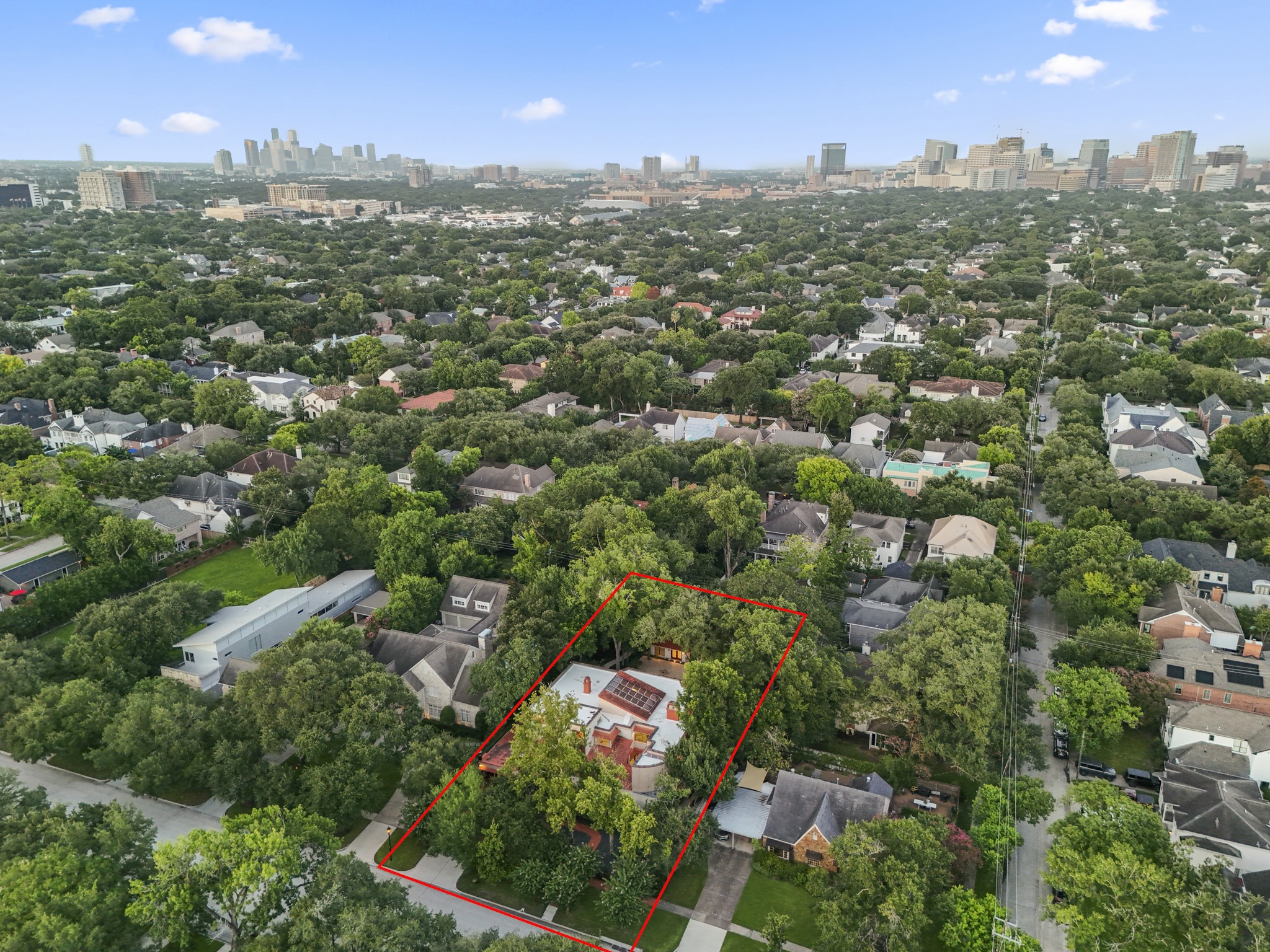 6535 Buffalo Speedway Houston, TX 77005 - Photo 34 of 34 This aerial perspective captures the full scale of the 20,000 square foot lot, surrounded by the tree-lined streets of West University, offering RARE space and privacy just minutes from Houston’s most desirable amenities.