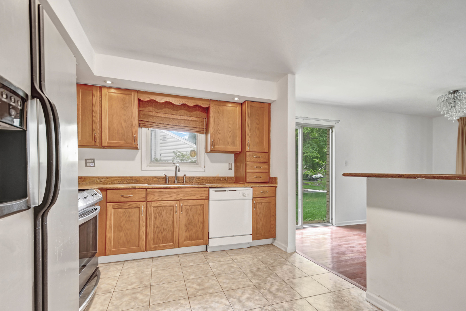 18932 Springfield Avenue Flossmoor, IL 60422 - Photo 8 of 22 a kitchen with stainless steel appliances granite countertop a refrigerator and sink