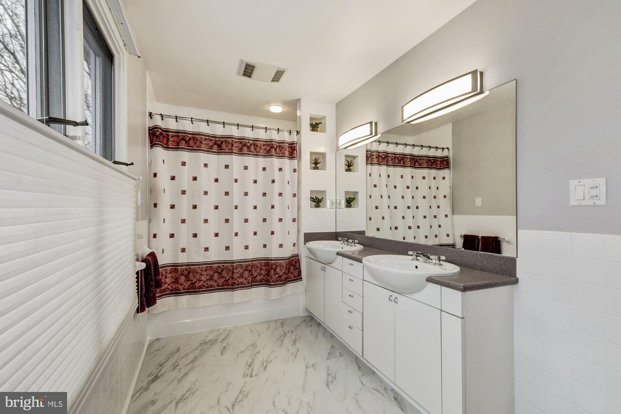 9608 Clearview Place Silver Spring, MD 20901 - Photo 22 of 31 Upper level bath with double vanity in gray tones