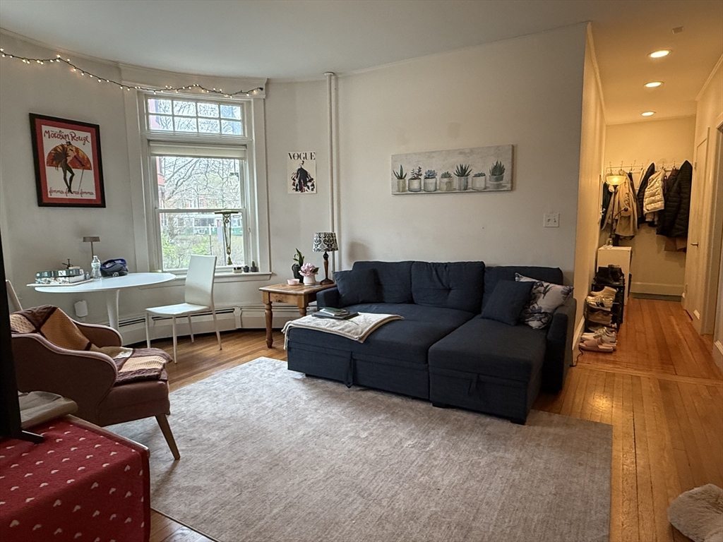 1871 Beacon Street, Unit 4 Brookline, MA 02445 - Photo 14 of 14 a living room with furniture a rug and a window