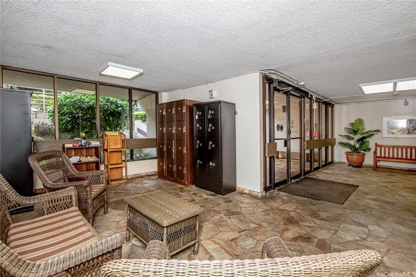 a living room with furniture a window and walk in closet