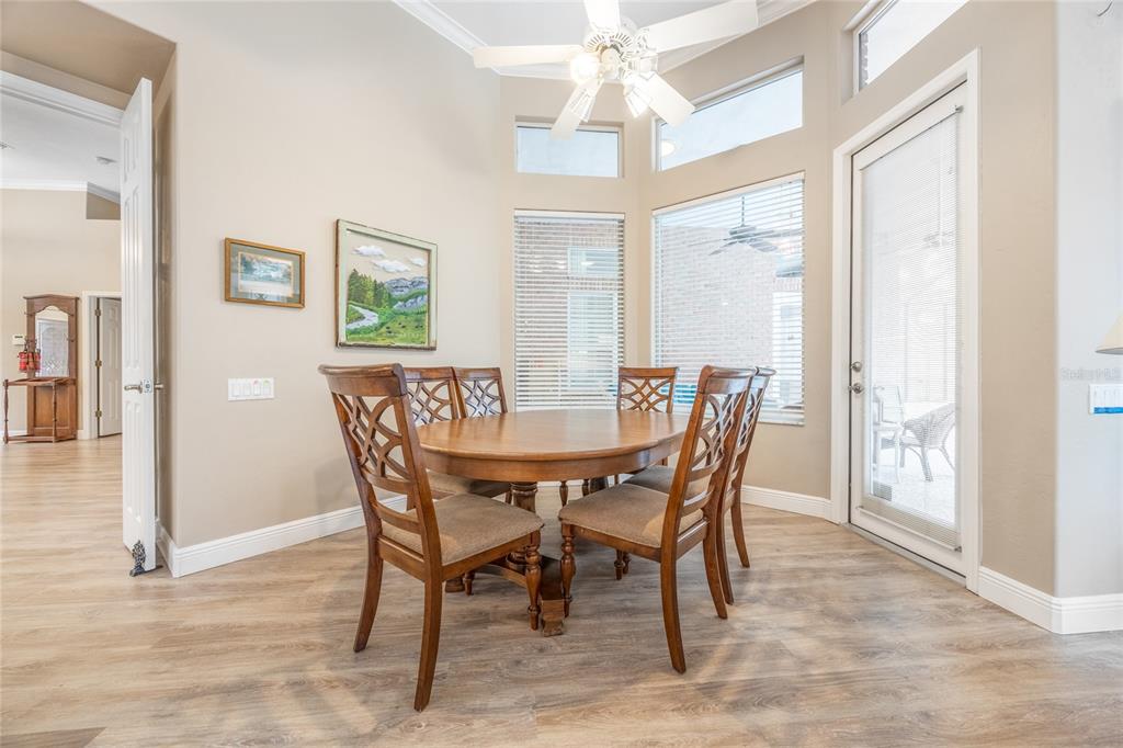 5922 Northwest 72 Street Gainesville, FL 32653 - Photo 11 of 52 a dining room with furniture a chandelier and a rug