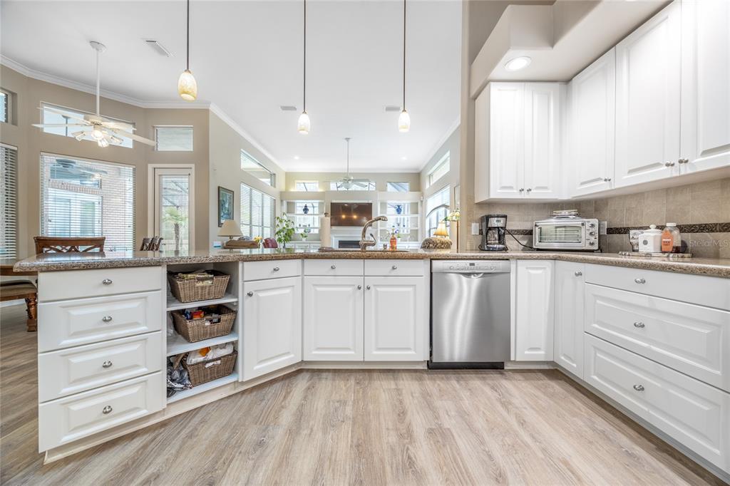 5922 Northwest 72 Street Gainesville, FL 32653 - Photo 14 of 52 a kitchen with cabinets stainless steel appliances and a window