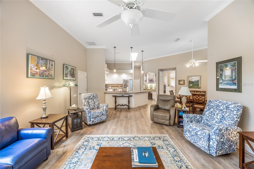 5922 Northwest 72 Street Gainesville, FL 32653 - Photo 20 of 52 a living room with furniture and a chandelier