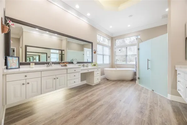 a bathroom with a bathtub and a shower
