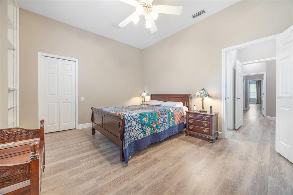 5922 Northwest 72 Street Gainesville, FL 32653 - Photo 35 of 52 a bedroom with a bed and a chandelier