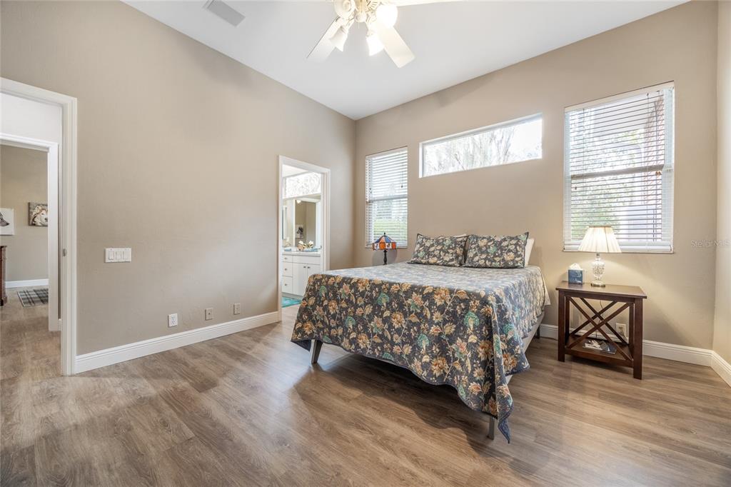 5922 Northwest 72 Street Gainesville, FL 32653 - Photo 38 of 52 a bedroom with a bed mirror and a window