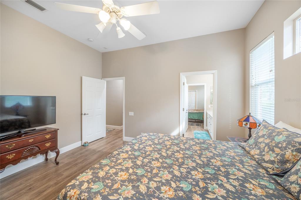 5922 Northwest 72 Street Gainesville, FL 32653 - Photo 39 of 52 a bedroom with a bed and a flat screen tv