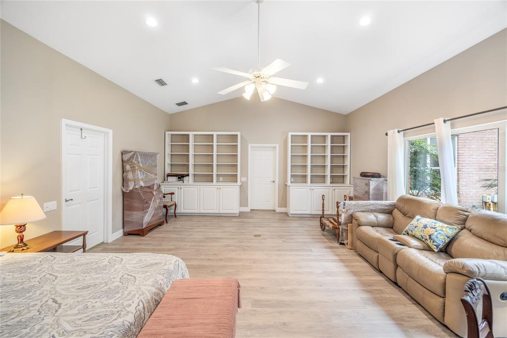 5922 Northwest 72 Street Gainesville, FL 32653 - Photo 46 of 52 a large bedroom with a large bed couch and a window