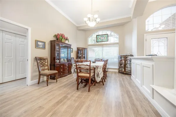 a view of a livingroom with furniture window and wooden floor