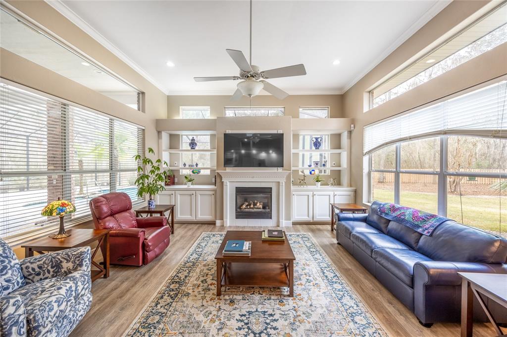 5922 Northwest 72 Street Gainesville, FL 32653 - Photo 10 of 52 a living room with furniture a large window and a fireplace