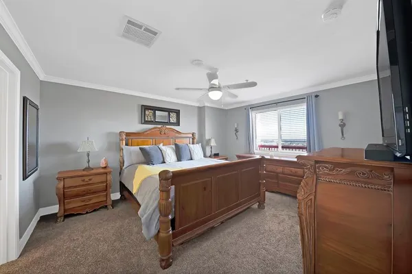 a bed room with a bed and a television