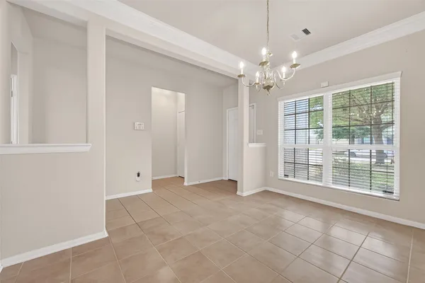 a kitchen with cabinets and stainless steel appliances