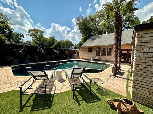 a view of a swimming pool with a patio
