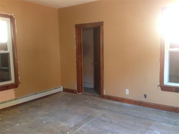 23 Emery Street Lowell, MA 01851 - Photo 3 of 5 an empty room with windows