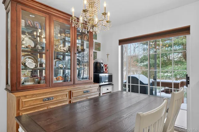 a view of a living room and chandelier with furniture