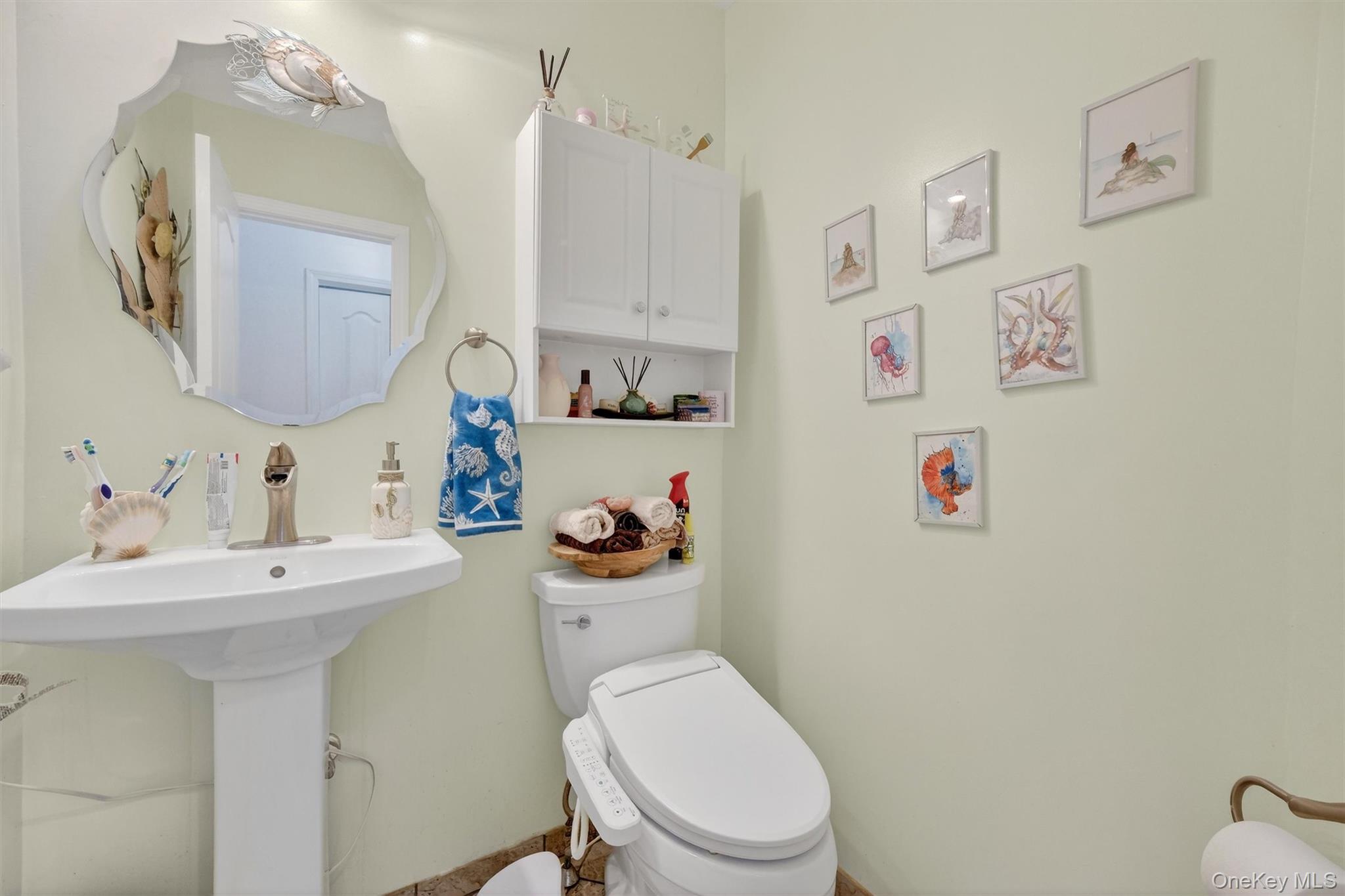 118 Elmcrest Drive Fishkill, NY 12524 - Photo 16 of 25 a bathroom with a sink a toilet and a mirror