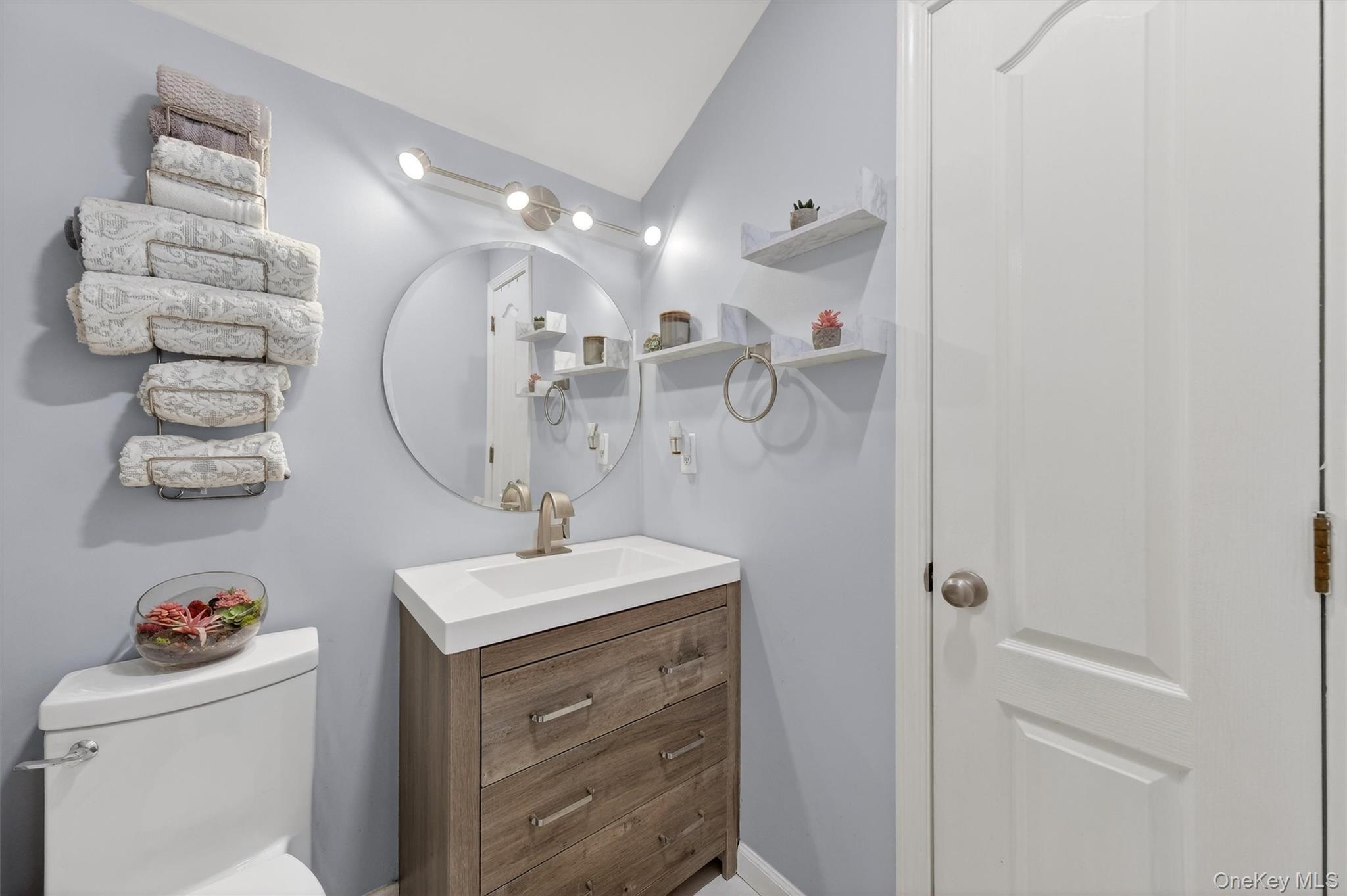118 Elmcrest Drive Fishkill, NY 12524 - Photo 19 of 25 a bathroom with a sink a toilet and a mirror