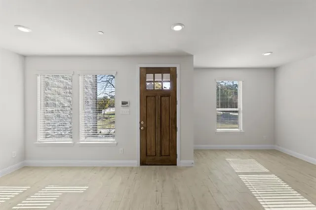 a view of an empty room with a window