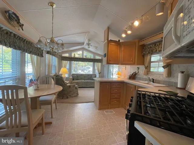 a kitchen with a table and chairs in it
