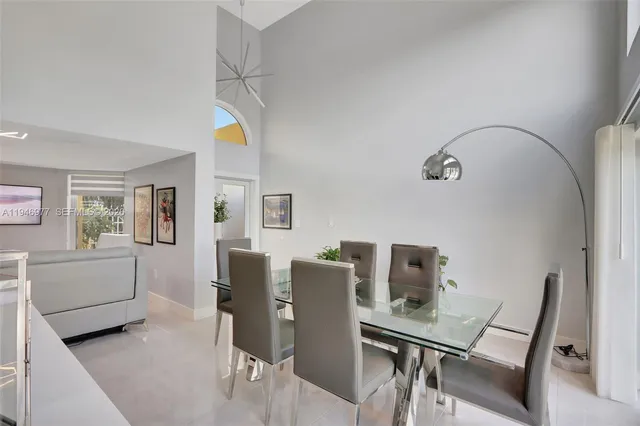 a room with a couch and a potted plant