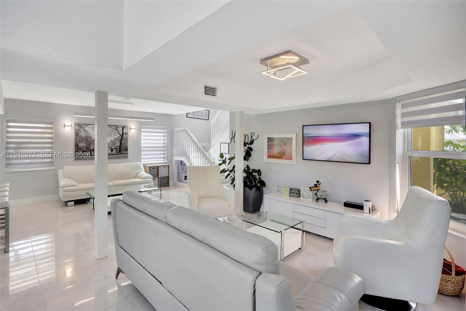 15481 Southwest 47th Terrace, Unit 15481 Miami, FL 33185 - Photo 17 of 29 a room with a couch and a potted plant