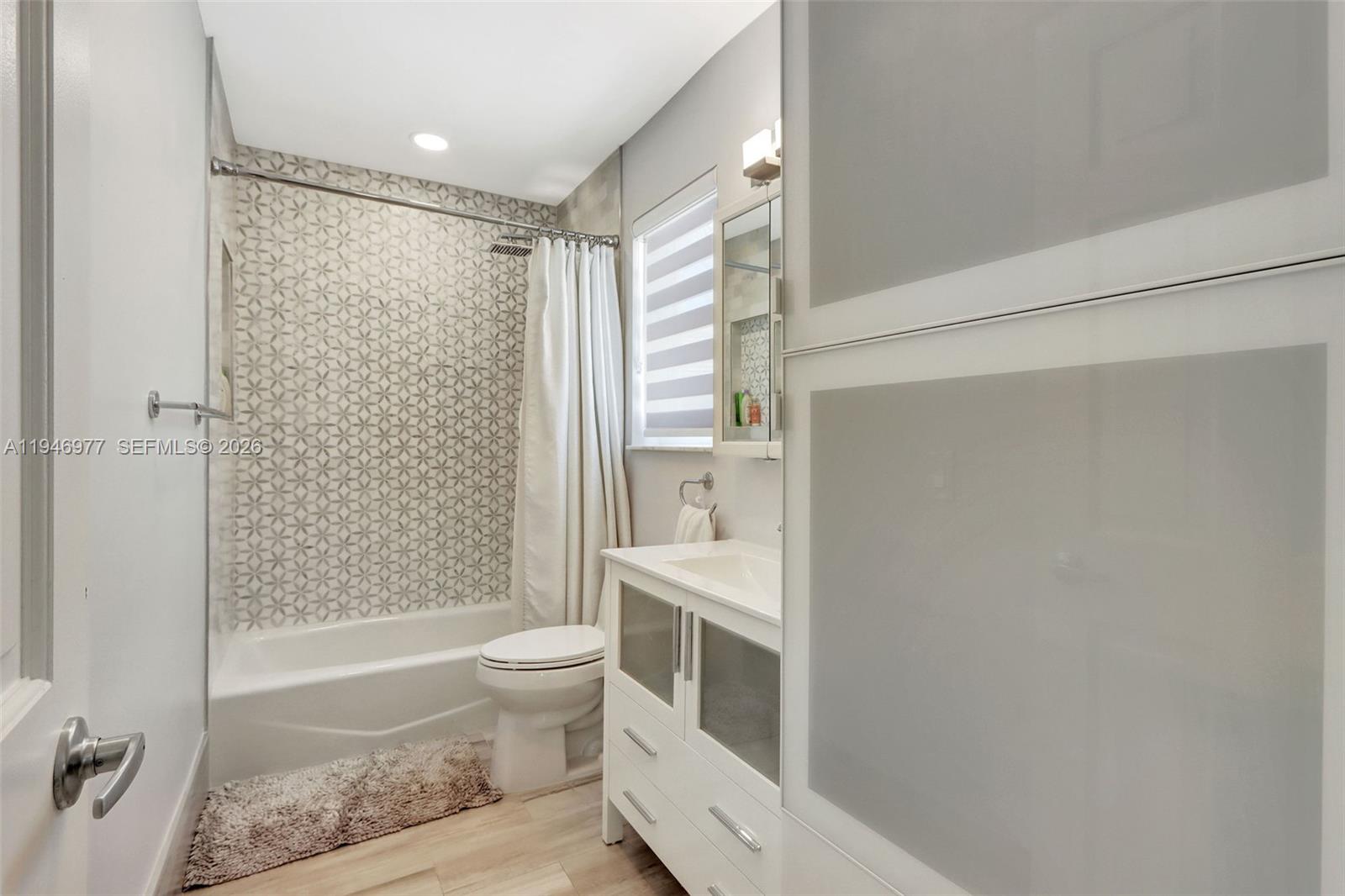 15481 Southwest 47th Terrace, Unit 15481 Miami, FL 33185 - Photo 28 of 29 a bathroom with a sink a toilet and shower