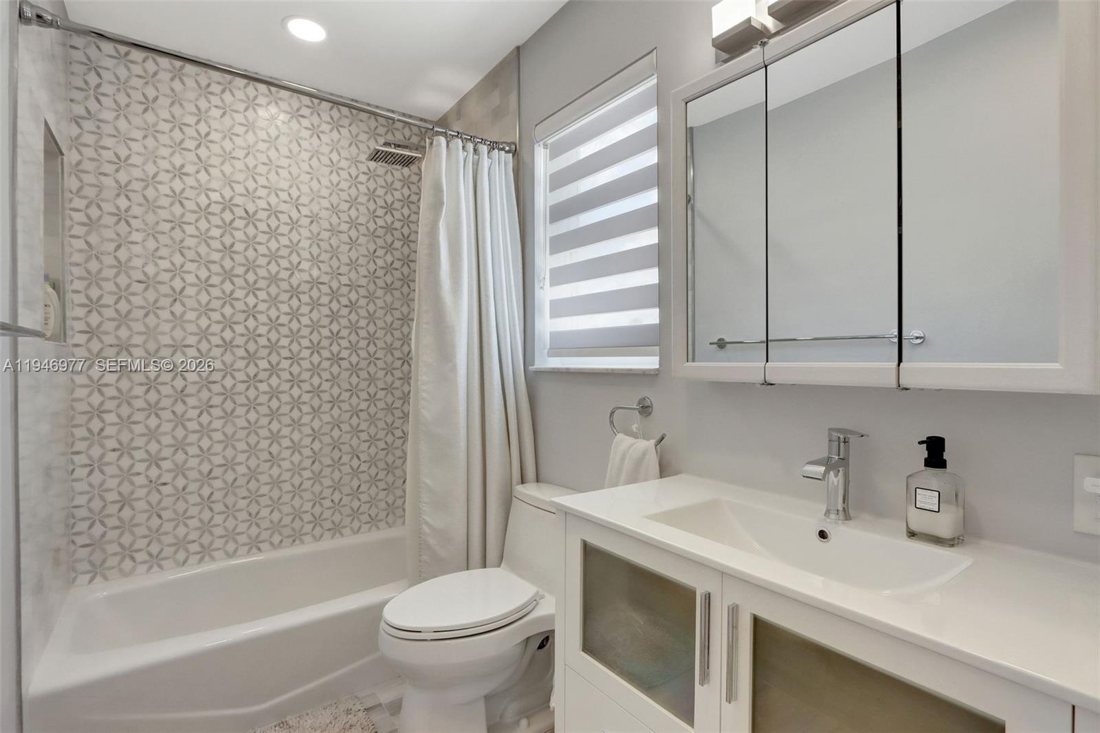 15481 Southwest 47th Terrace, Unit 15481 Miami, FL 33185 - Photo 29 of 29 a bathroom with a sink toilet and shower