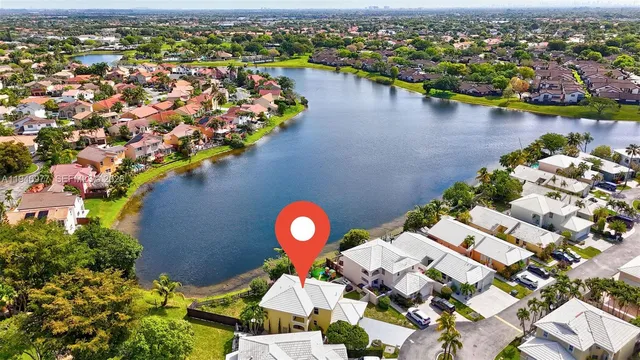 an aerial view of a house with a swimming pool yard and outdoor seating