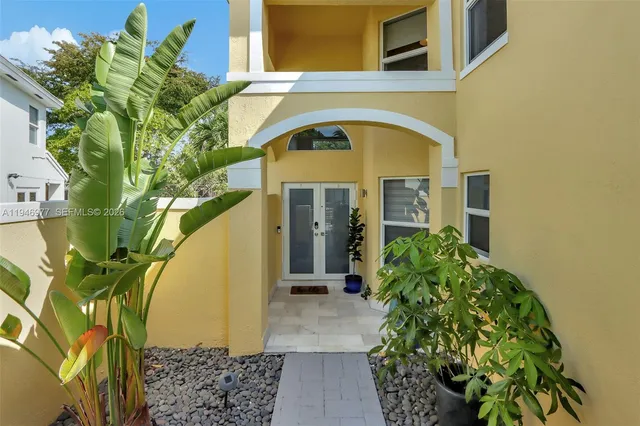 a front view of a house with garden