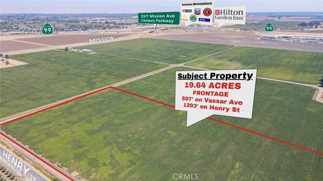 a sign that is on the side of the grass