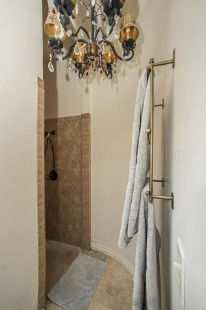 a en suite bathroom with a sink double vanity and a mirror