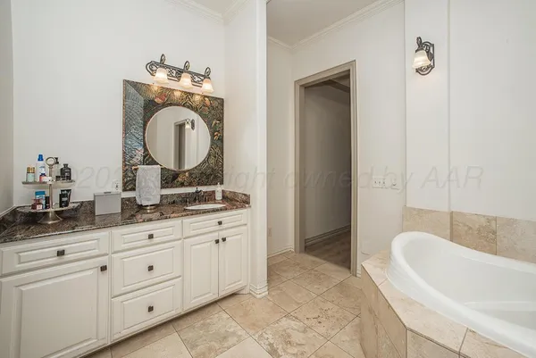 a bathroom with a toilet a window and tub