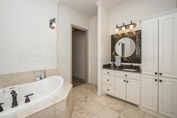 a en suite bathroom with a sink and a mirror