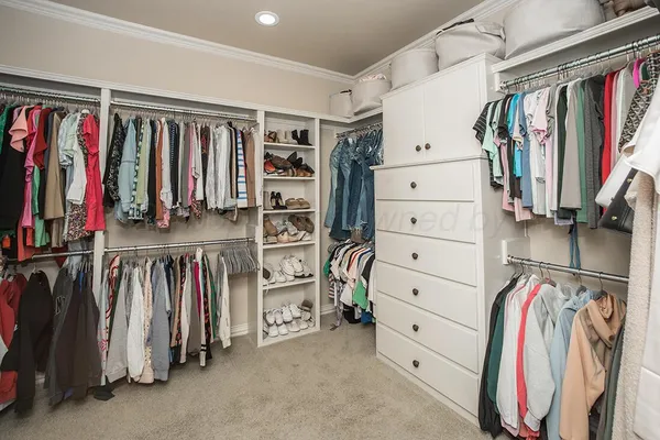 a bedroom with a bed and a table