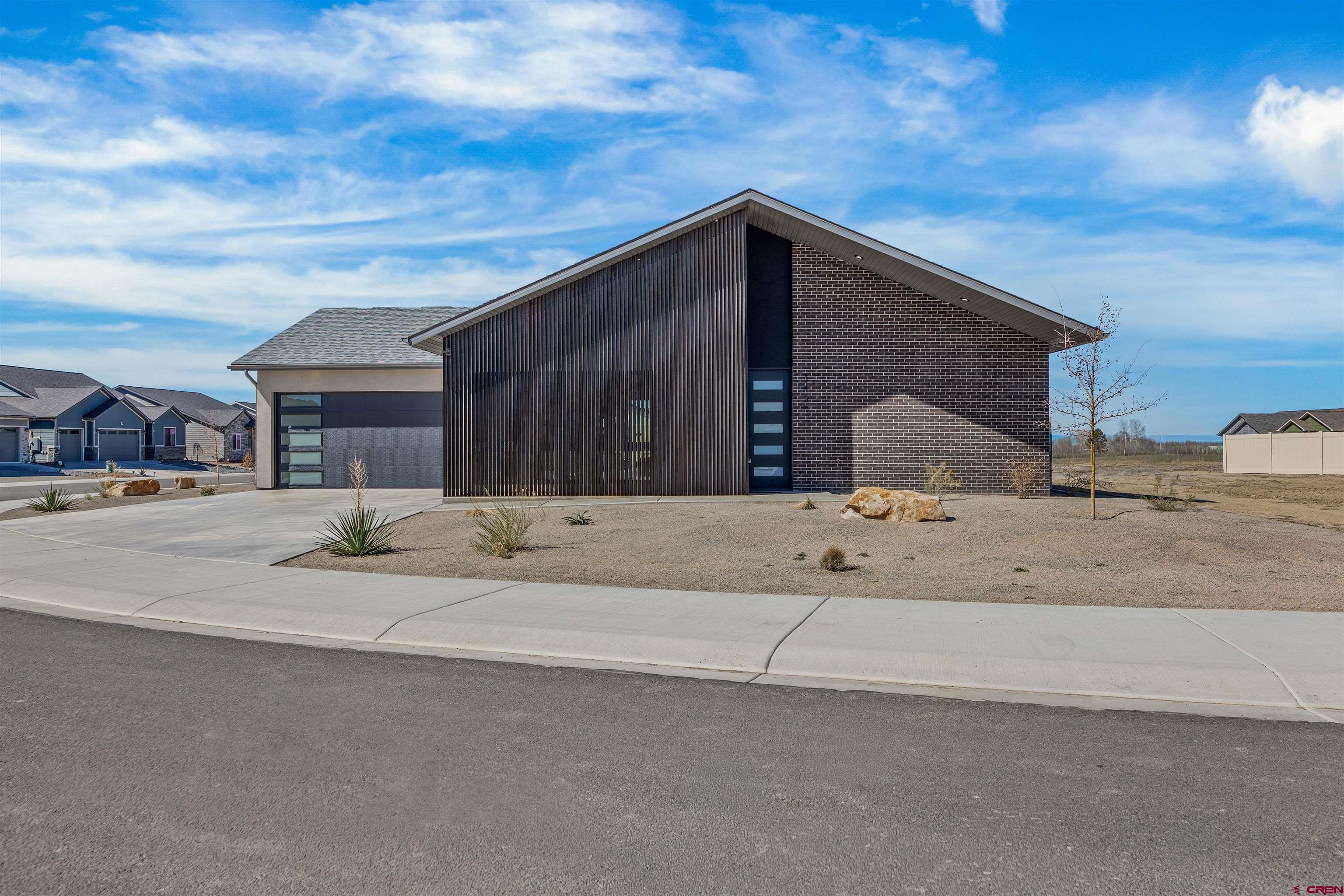 3435 Kestrel Loop Montrose, CO 81401 - Photo 1 of 34 a house with a outdoor space