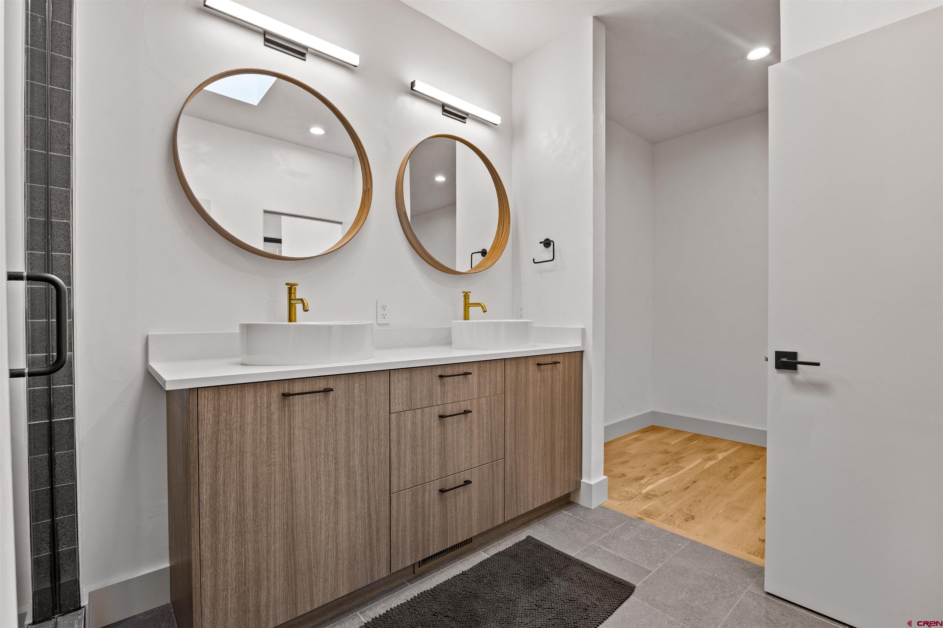 3435 Kestrel Loop Montrose, CO 81401 - Photo 17 of 34 a bathroom with a sink and a mirror