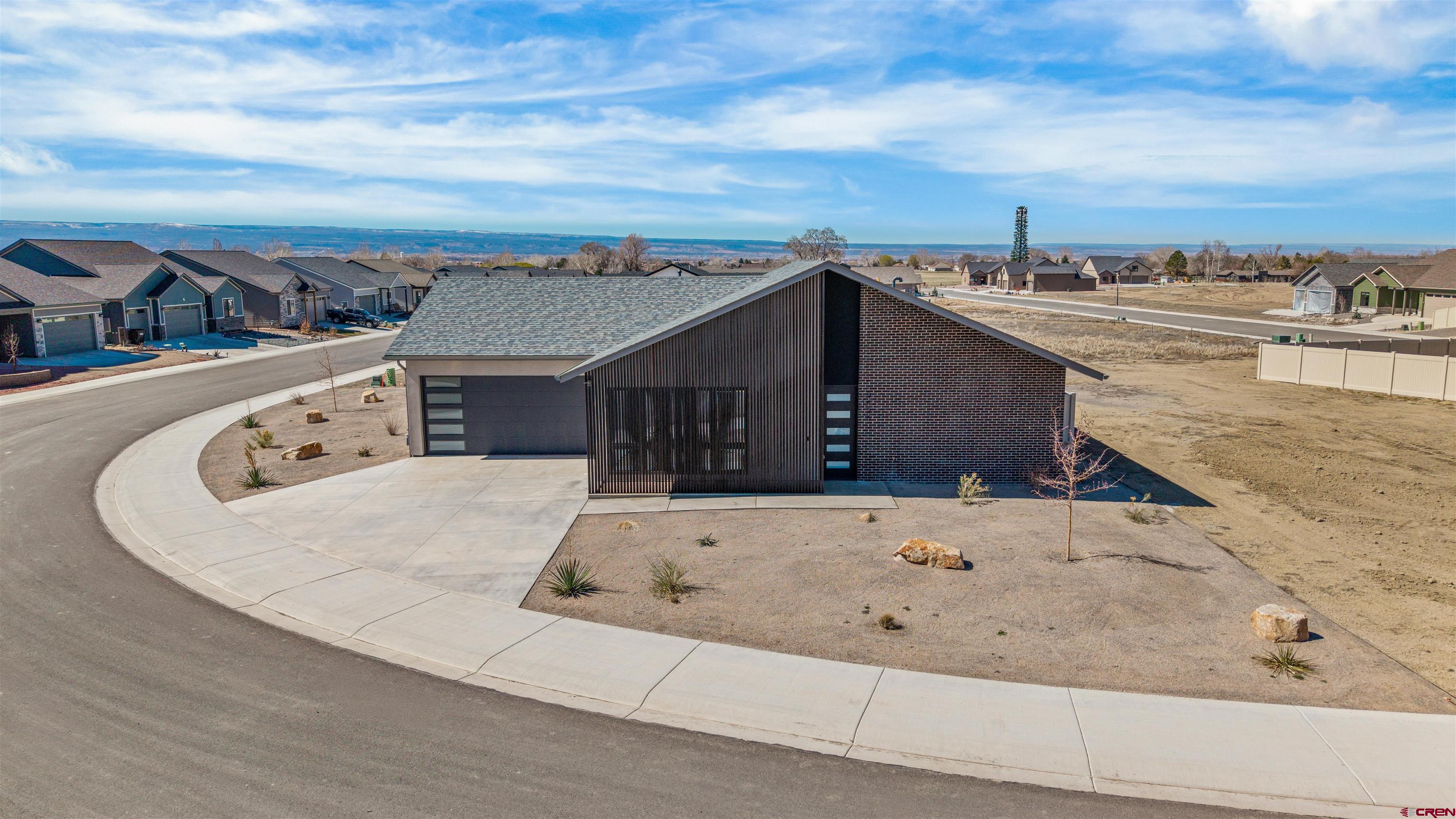 3435 Kestrel Loop Montrose, CO 81401 - Photo 2 of 34 an aerial view of house with swimming pool