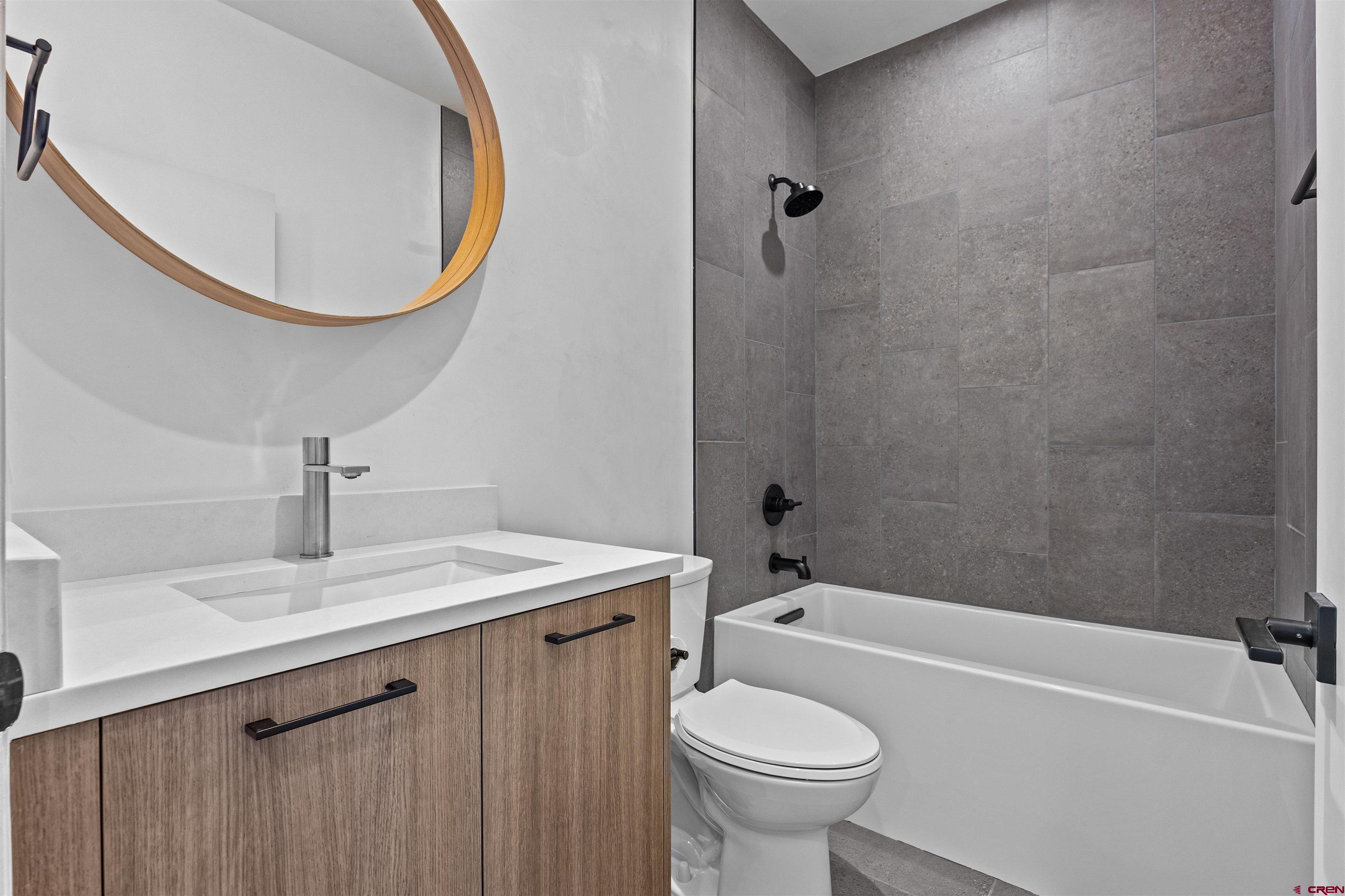3435 Kestrel Loop Montrose, CO 81401 - Photo 24 of 34 a bathroom with a sink and a mirror
