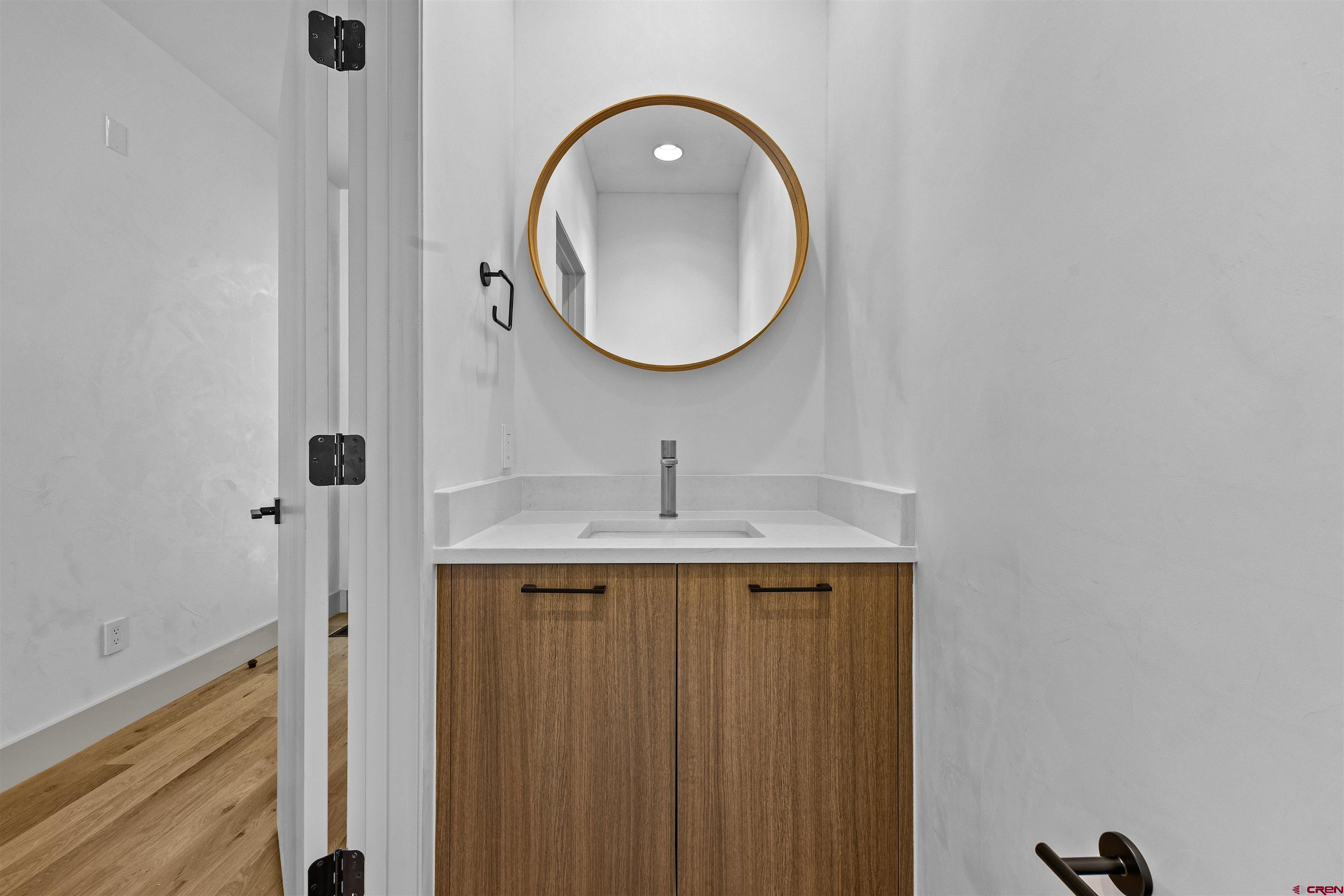 3435 Kestrel Loop Montrose, CO 81401 - Photo 25 of 34 a bathroom with a sink and a mirror