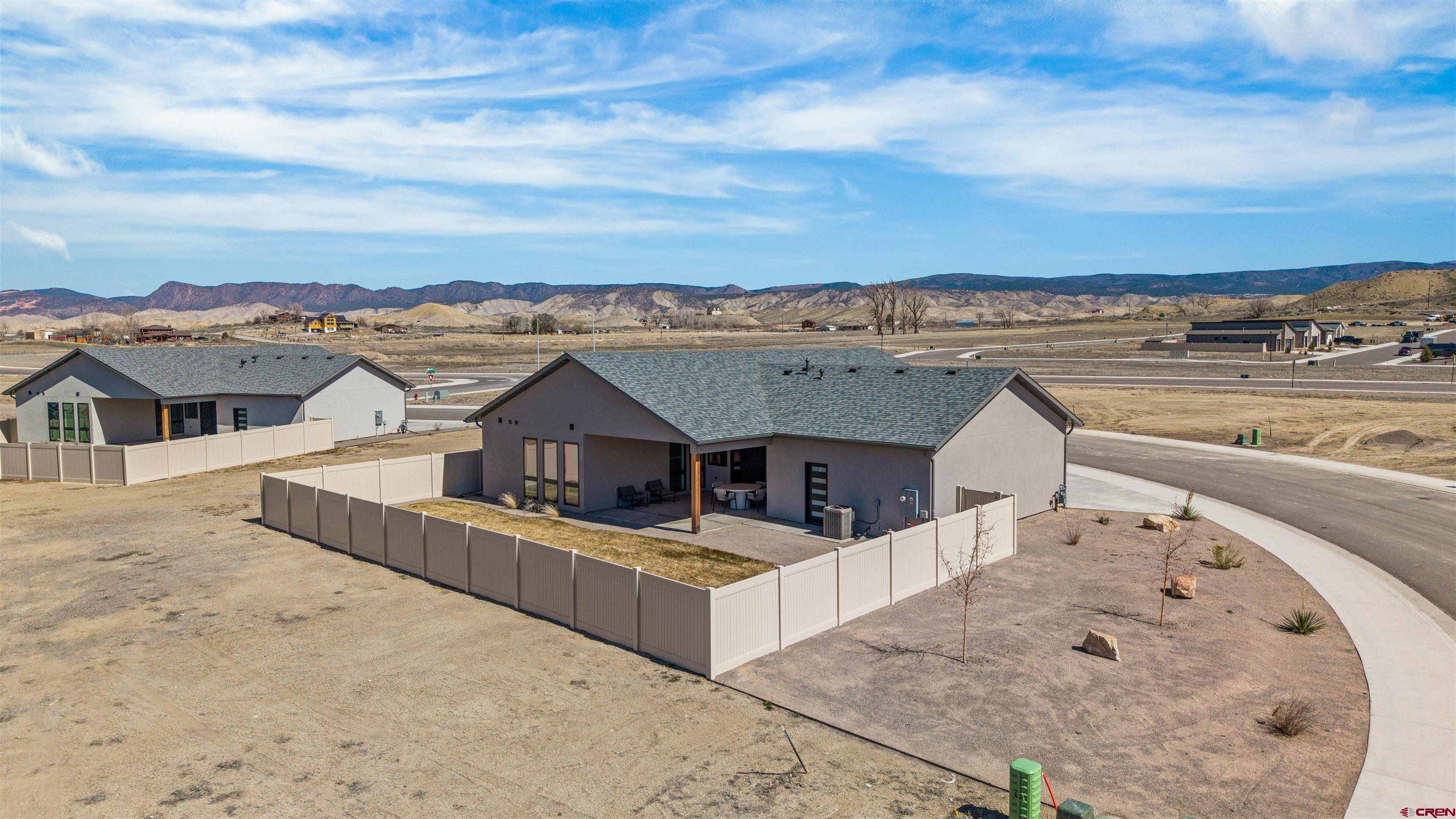 3435 Kestrel Loop Montrose, CO 81401 - Photo 33 of 34 an aerial view of a house with a big yard