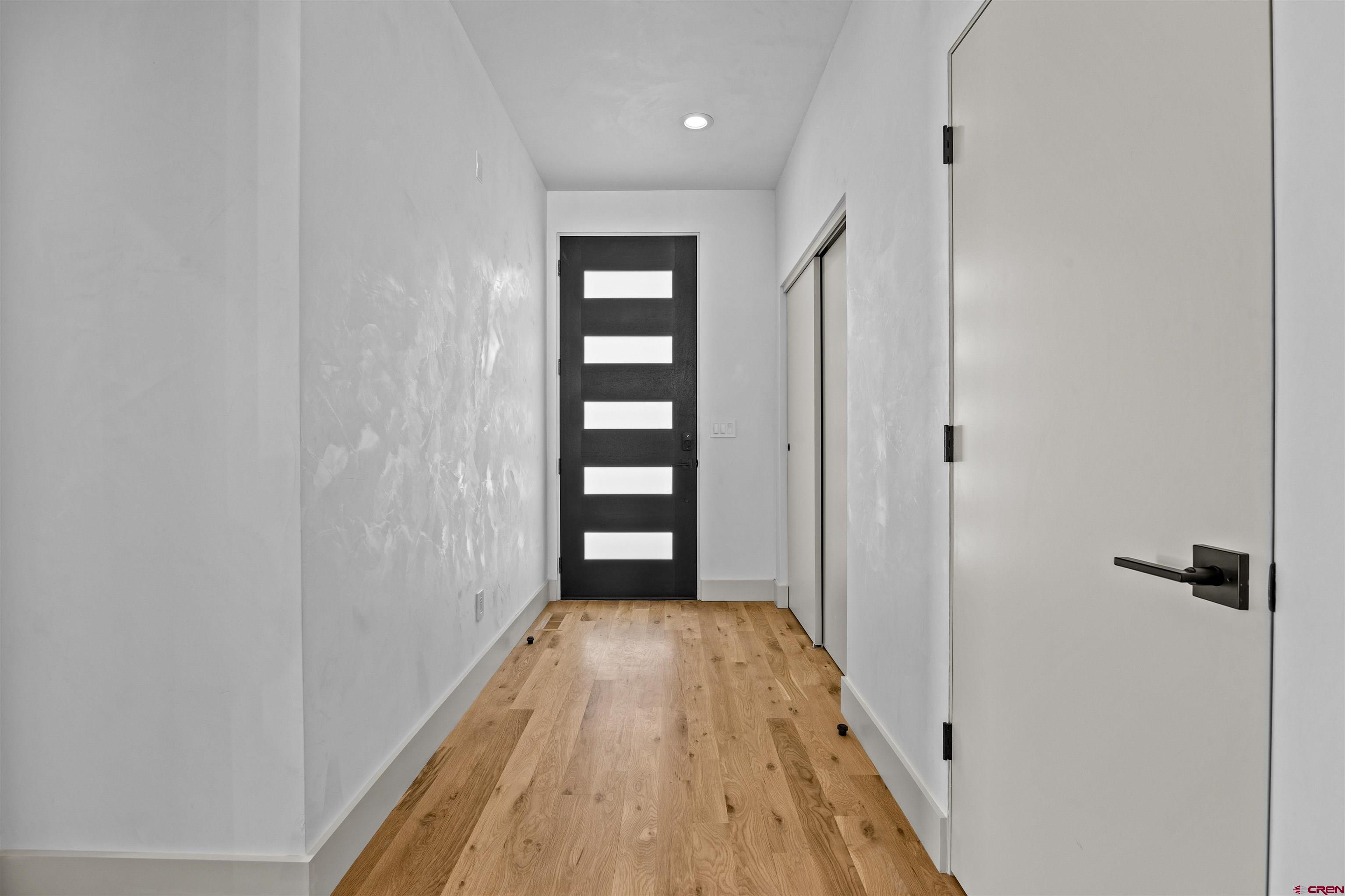 3435 Kestrel Loop Montrose, CO 81401 - Photo 6 of 34 a view of hallway with wooden floor