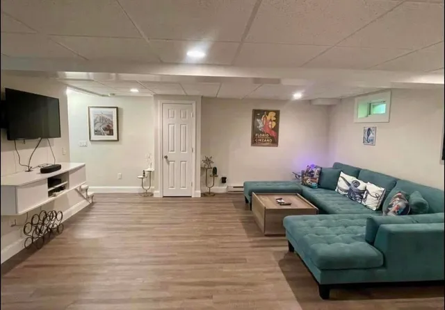 a living room with furniture and a flat screen tv