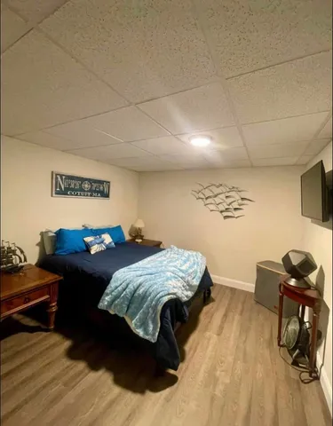 a bedroom with a bed and a dresser