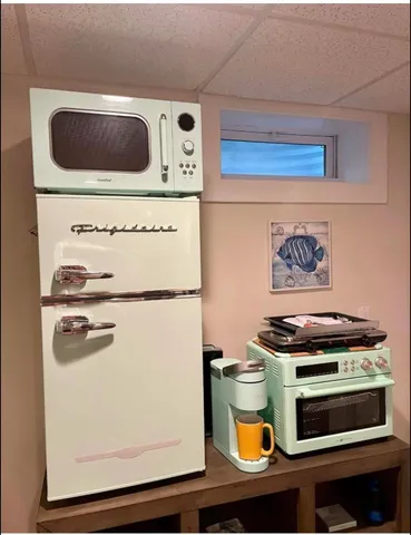 a kitchen with stainless steel appliances granite countertop a stove and a microwave