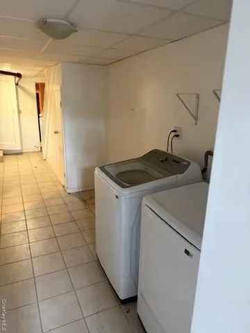 a utility room with washing machine