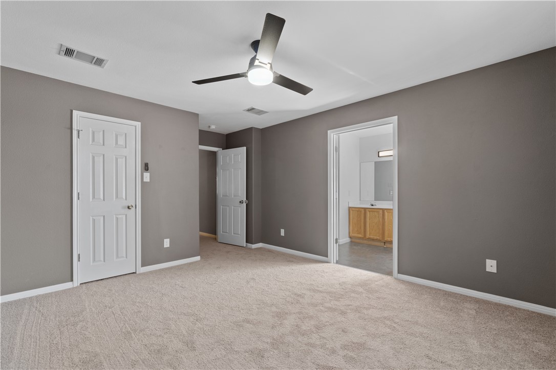 1533 Lorson Loop Round Rock, TX 78665 - Photo 14 of 27 a view of an empty room and chandelier fan