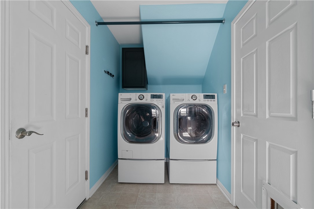 1533 Lorson Loop Round Rock, TX 78665 - Photo 10 of 27 a utility room with dryer and washer
