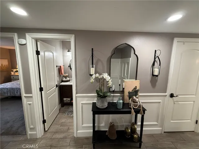 a dining room with furniture and a chandelier