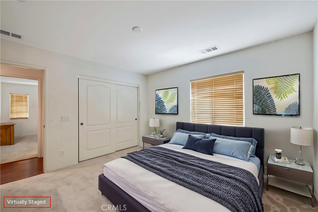 3819 St Austell Way Perris, CA 92571 - Photo 38 of 64 a bedroom with bed and window